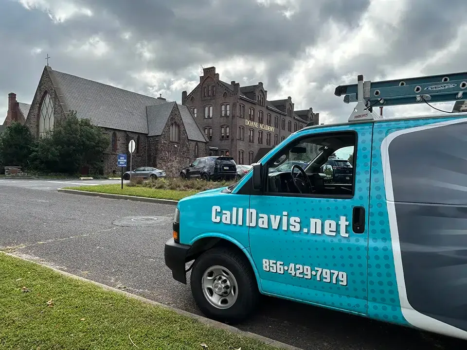 Davis Heating & Air truck in Burlington in front of Doane Academy.