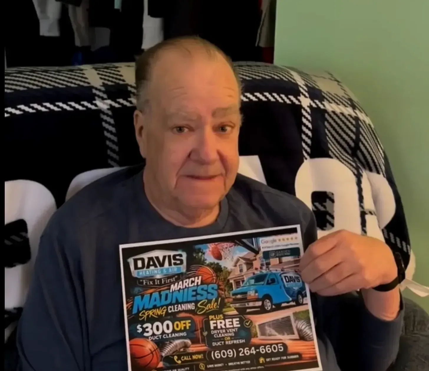 Davis customer with flyer at home