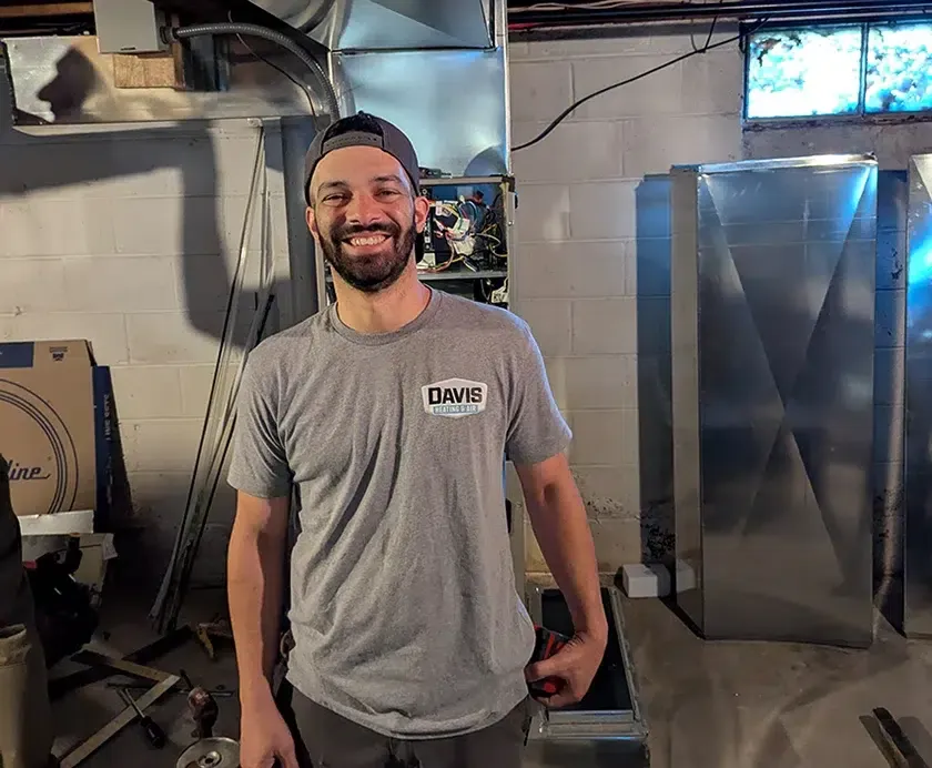Davis Heating and Air technician smiling during HVAC service in Cherry Hill