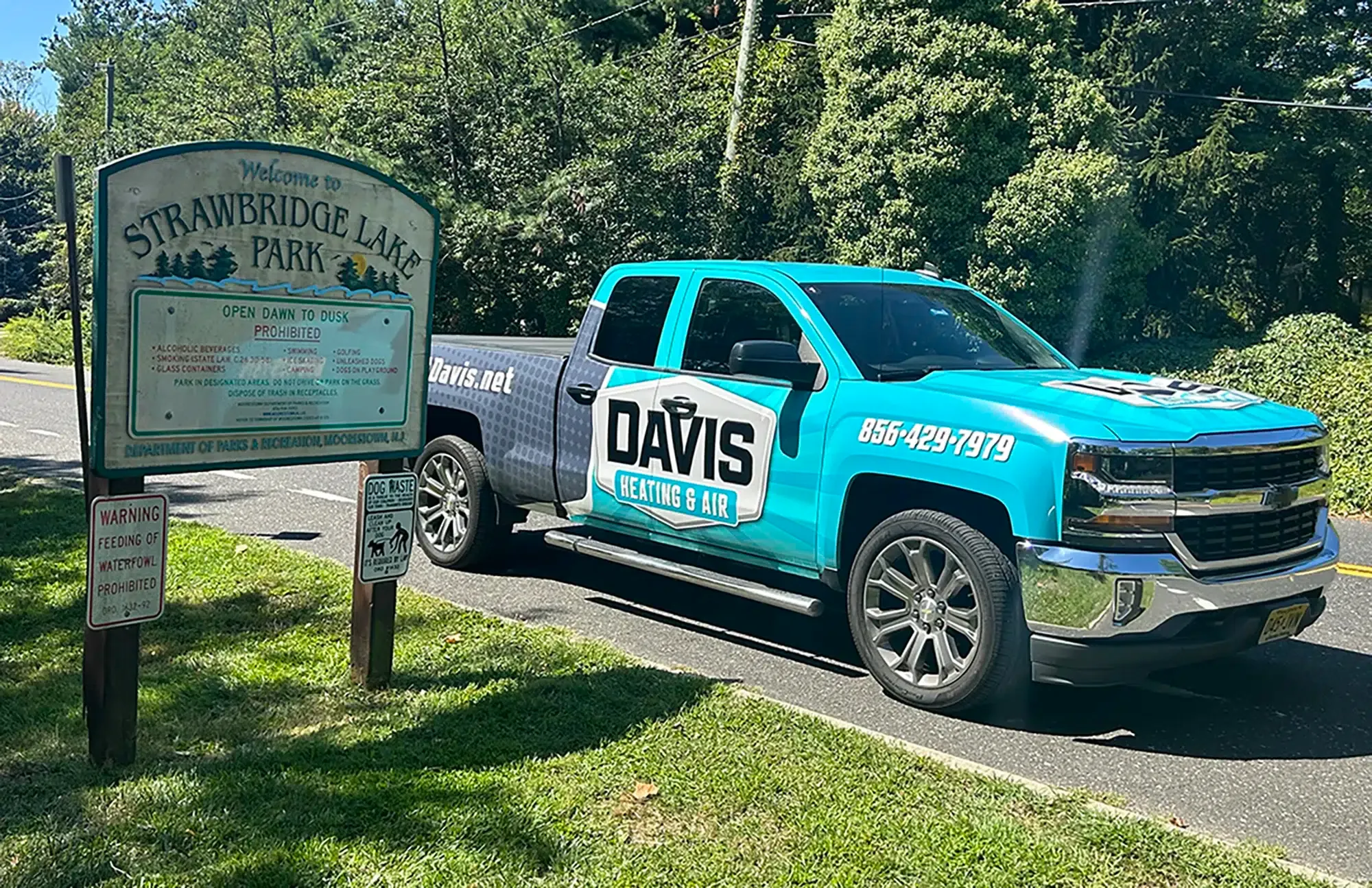 Davis Heating & Air truck in Mt Laurel in front of Strawbridge Lake Park.