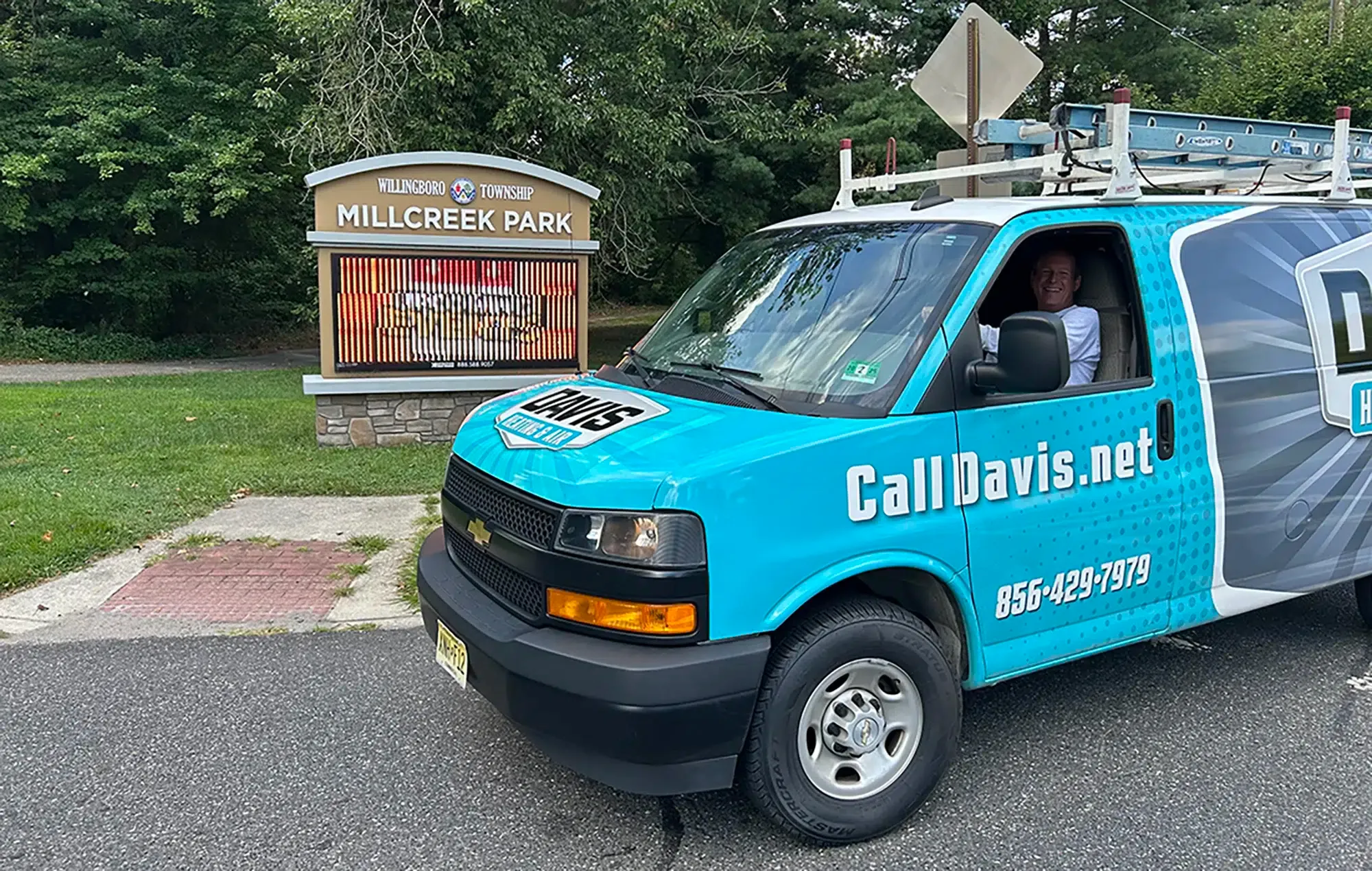 Davis Heating & Air truck outside of Millcreek Park.