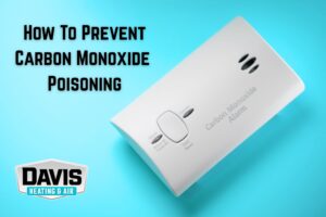 a carbon monoxide detector isolated on a cyan background to remind homeowners in Cherry Hill, NJ, and nearby areas about tips to prevent carbon monoxide poisoning