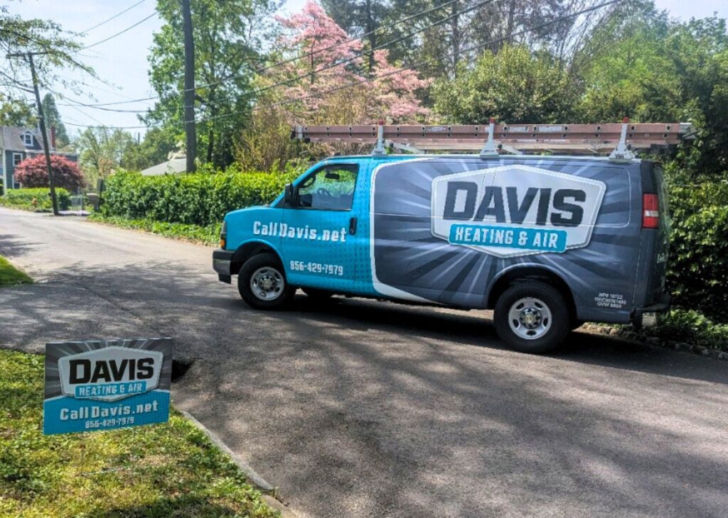 a Davis Heating and Air branded vehicle on a small residential street in Mount Laurel, NJ, ready to perform HVAC service