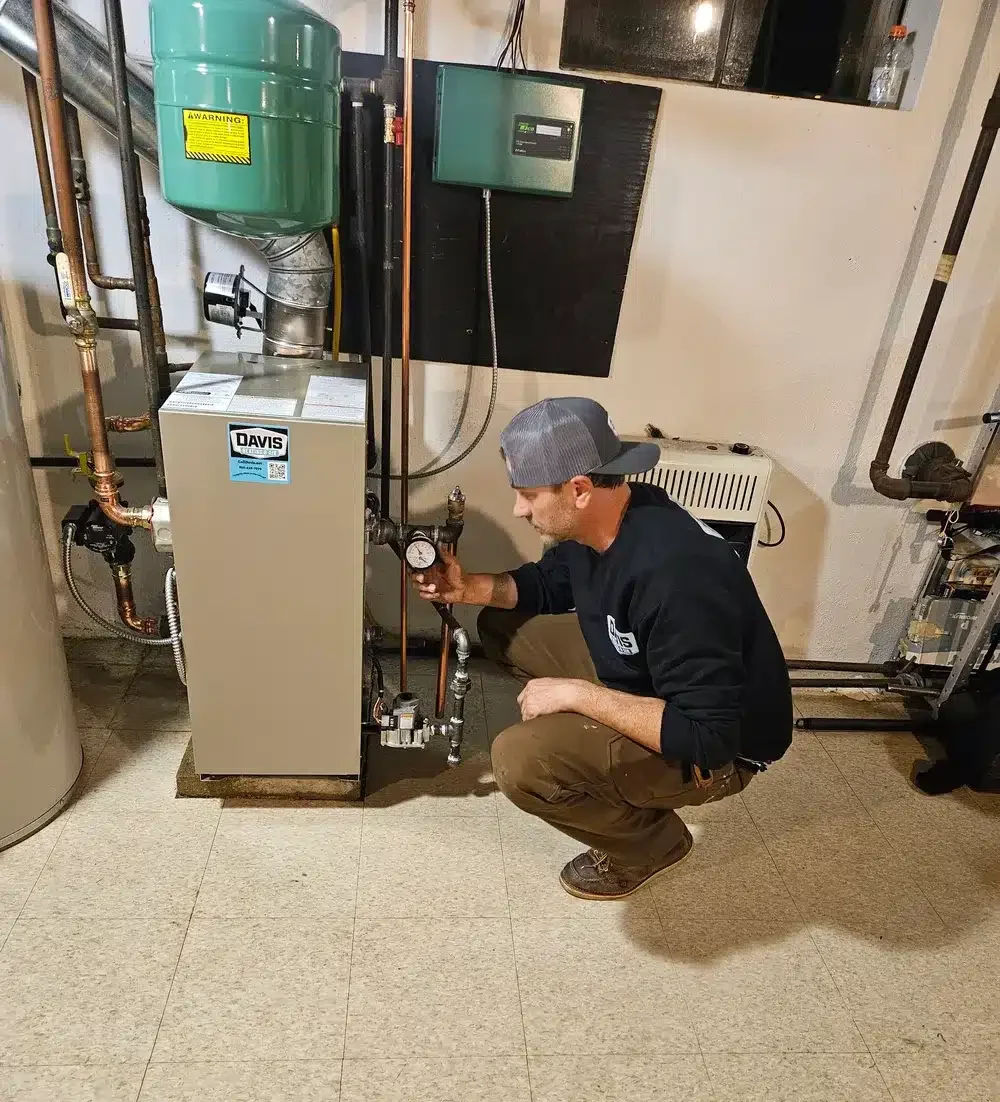 Technician inspecting boiler in Cherry Hill