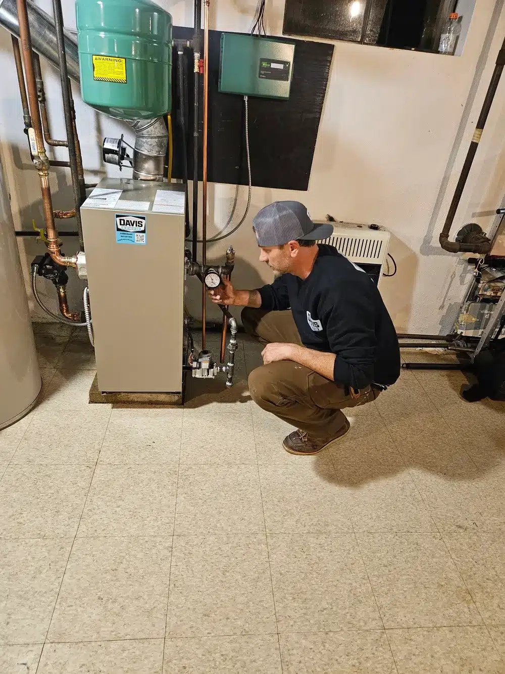 Technician inspecting boiler in Cherry Hill