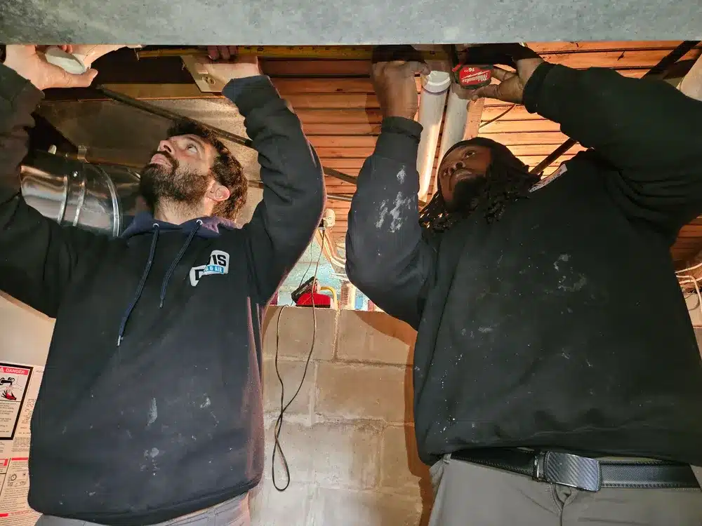 Technicians repairing ductwork in Cherry Hill